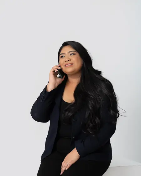 Chelsea Javier on a phone call, smiling