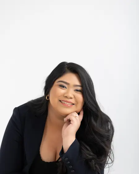 Chelsea Javier smiling, hand resting on her chin