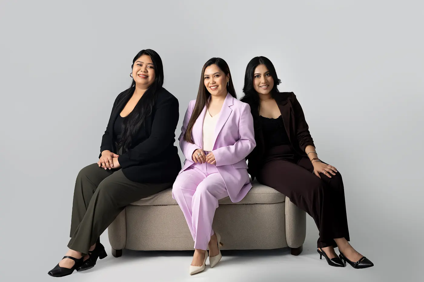 The Porras Real Estate team at Keller Williams Urbain, three brokers seated together in a studio
