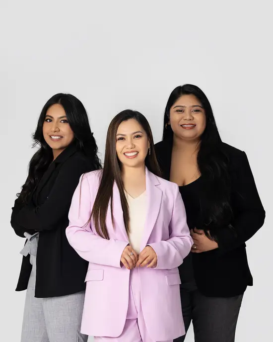 The Porras Real Estate team standing side by side in a studio